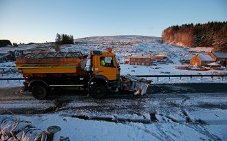 A gritter passes Killhope mine in Co Durham following a snowfall on Saturday morning