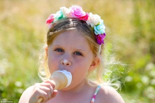 Missed a bit! Summer Bayes, four, enjoys an ice cream in the sunshine at Marine Park in South Shields as the UK basks in warm weather