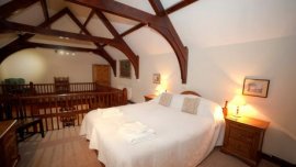 The galleried bedroom at Abbey Stores,  nr Ripon,  Yorkshire © National Trust