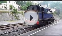 A smoky carriage in a steam train going through a tunnel