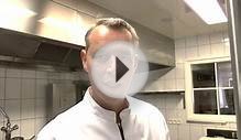 Bart Desmidt prepares a scallop starter at his Michelin